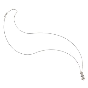 A diamond and 14k white gold pendant necklace