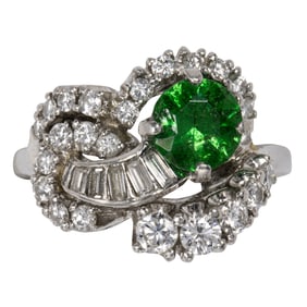 A tsavorite garnet, diamond, and platinum ring