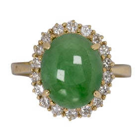 A jade, diamond, and 18k gold ring