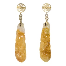 A pair of golden jade and 14k gold earrings
