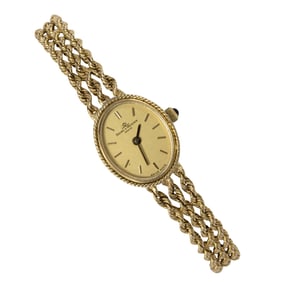 A Baum and Mercier 14k gold dress watch