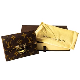A Louis Vuitton monogram canvas Portefeuille Koala three fold wallet with gold hardware