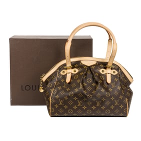 A Louis Vuitton monogram coated canvas Tivoli GM bag with leather straps and gold tone hardware
