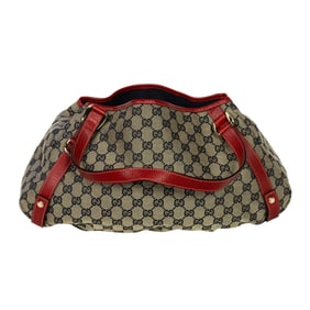 A vintage Gucci blue monogram canvas Abbey satchel with red leather trim and D-ring detail
