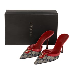 A vintage pair of Gucci blue monogram canvas ladies' mules with red leather trim