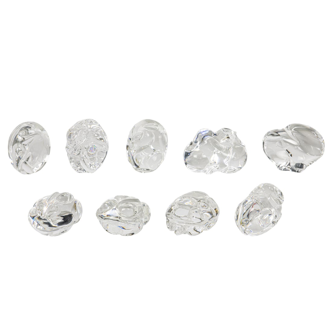 Nine Steuben glass handwarmers: Nine Steuben glass handwarmers, including rabbit, elephant, dragon, frog, turtle, eagle, puppies and ram, greatest 3"l. Provenance: The Carole Harris Collection, River Ranch. The interiors guided by P