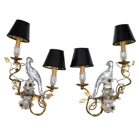 A pair of French style gilt iron and mirrored glass two-light wall sconces in the manner of Maison