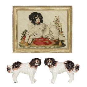 An English needlepoint of a spaniel and pair of Staffordshire standing dogs