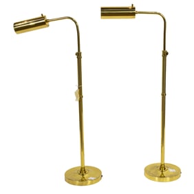 A pair of brass adjustable reading lamps
