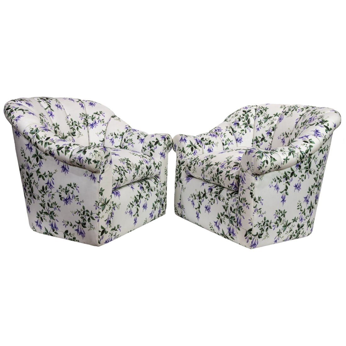 A pair of swivel lounge chairs: A pair of swivel lounge chairs, with channel back and loose cushion, floral upholstery is likely Schumacher, 32.5"h x 37"w x 36"d. Provenance: The Carole Harris Collection, River Ranch. The interiors 