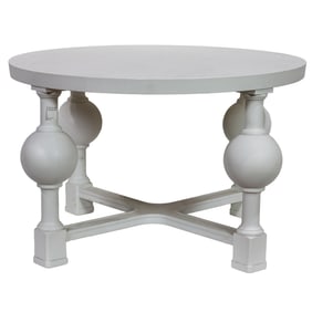 A contemporary white painted round center table