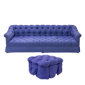 A large Chesterfield style sofa with ottoman in periwinkle