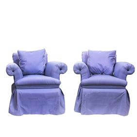 An assembled pair of light purple upholstered swivel lounge chairs