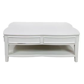 A large white painted quatrefoil coffee table
