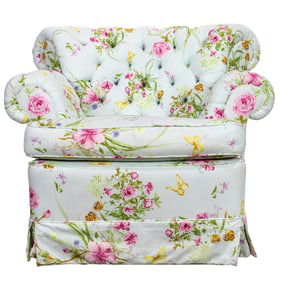 A pair of swivel and rocking lounge chairs