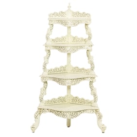 An Anglo-Indian white painted carved etagere