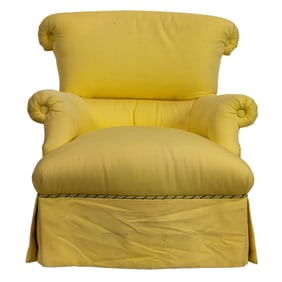 A custom yellow upholstered swivel lounge chair