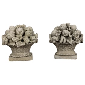 Two cast stone fruit filled baskets