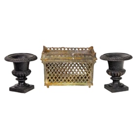 A group of cast iron garden vessels