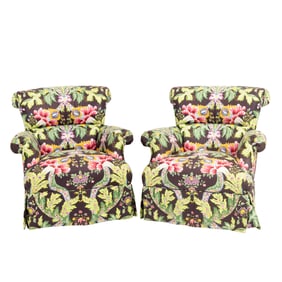 A pair of swivel and rocking lounge chairs