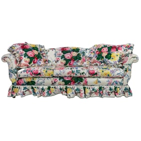 A three-cushion sofa upholstered in Lee Jofa cotton Floral Bouquet upholstery