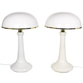 An assembled pair of enameled metal and brass table lamps in the manner of John Dickinson