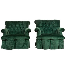 A pair of deep green tufted rocker armchairs