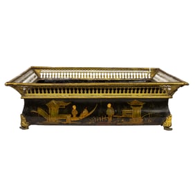 A Chinoiserie decorated parcel gilt decorated tole rectangular jardiniere