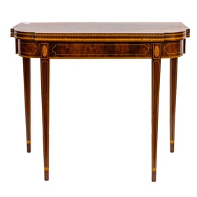 A Regency style inlaid mahogany flip top game table