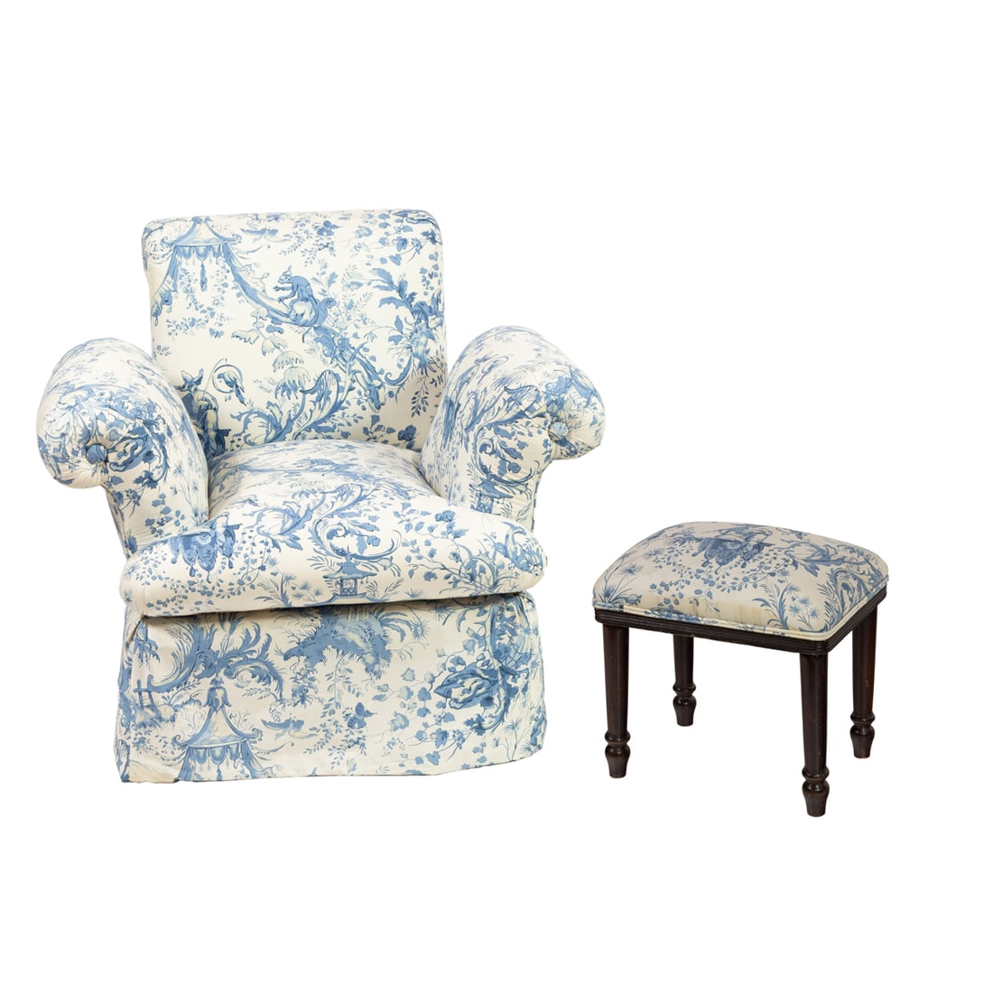 A lounge chair and stool upholstered in Chinoiserie blue toile fabric: A lounge chair and stool upholstered in Chinoiserie blue toile fabric, the chair with outswept arms and back, 31"h x 37"w x 27"d, together with an associated stool, 16"h x 17"w x 12"d [2 total]. Prove