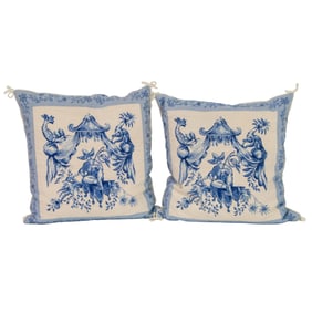 Two blue and white needlepoint pillows in a Chinoiserie design with three matching toile pillow sham