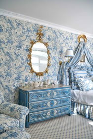 A pair of blue and white needlepoint pillows in a Chinoiserie design