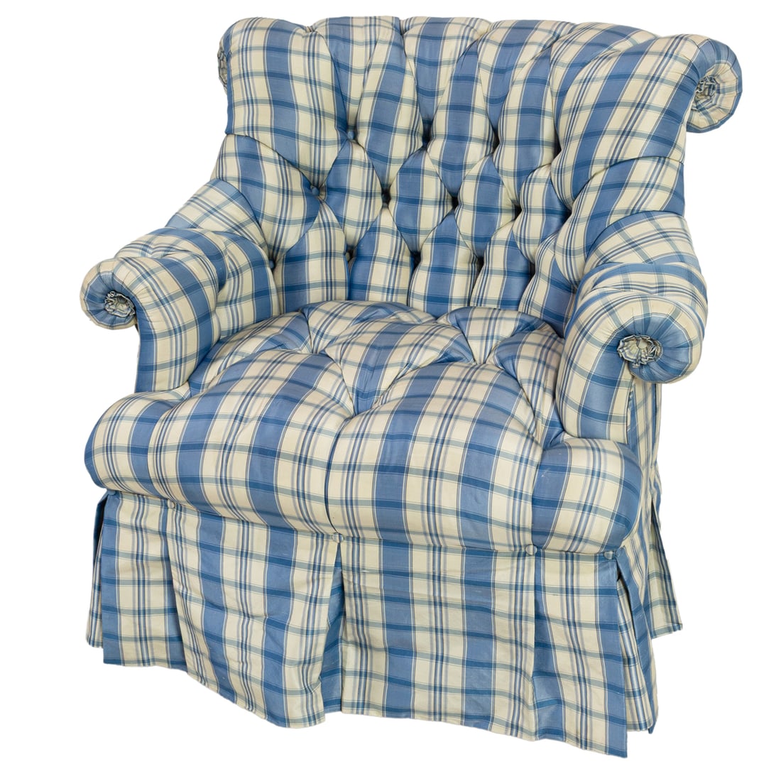 A tufted club chair with plaid upholstery: A tufted club chair with plaid upholstery, rolled arms, and a pleated skirt concealing the tapered legs, 31"h x 34"w x 33"d, seat 17"h. Provenance: The Carole Harris Collection, River Ranch. The inter