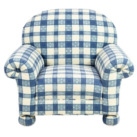 A large blue and white gingham upholstered club chair