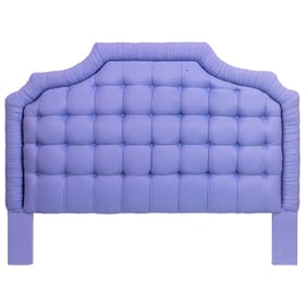 A pale purple upholstered headboard