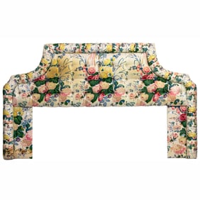 A floral upholstered button tufted headboard