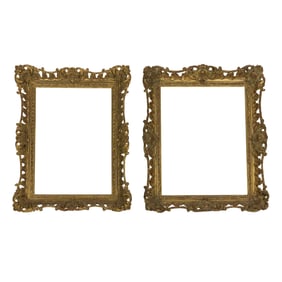 An assembled pair of Rococo style giltwood and gesso frames