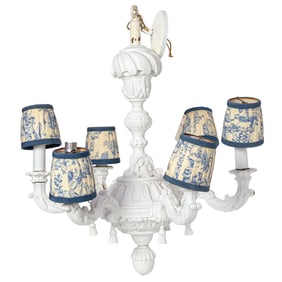 A white painted wood six light chandelier with toile shades