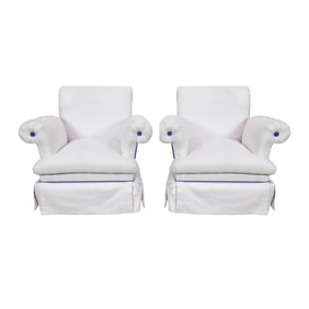 A pair of white canvas scrolled arm swivel rocker chairs