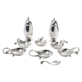 A set of six Georg Jensen sterling salt cellars and spoons,#110; with (1) pair of salt and pepper