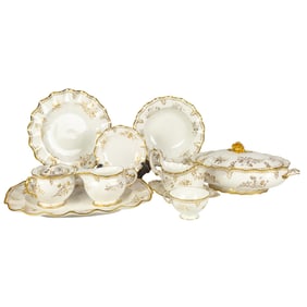 A Royal Crown Derby gilt decorated porcelain dinner service in the Royal St. James pattern A1145