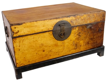 A leather wrapped chest in the Chinese taste on later stand