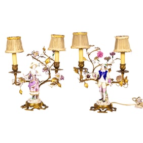 A Continental floral encrusted gilt metal and porcelain figural assembled clock garniture