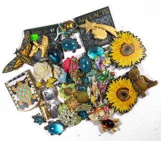 Thirty-five pieces of whimsical costume jewelry brooches comprising Red Sled, KC, Artifacts,