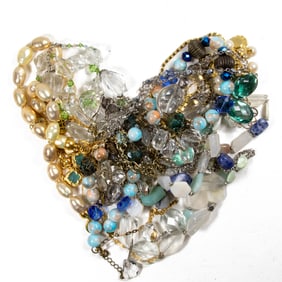 Ten costume jewelry necklaces, one with matching pair of earrings