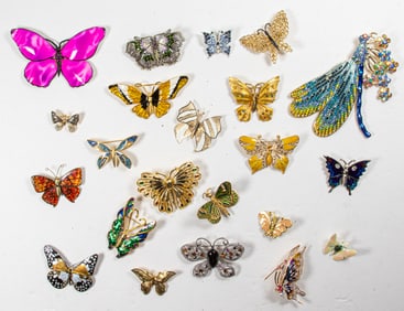 Twenty-two costume jewelry brooches of butterflies