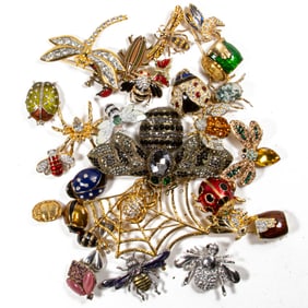 Twenty-seven costume jewelry brooches of spiders, ladybugs, bees and others