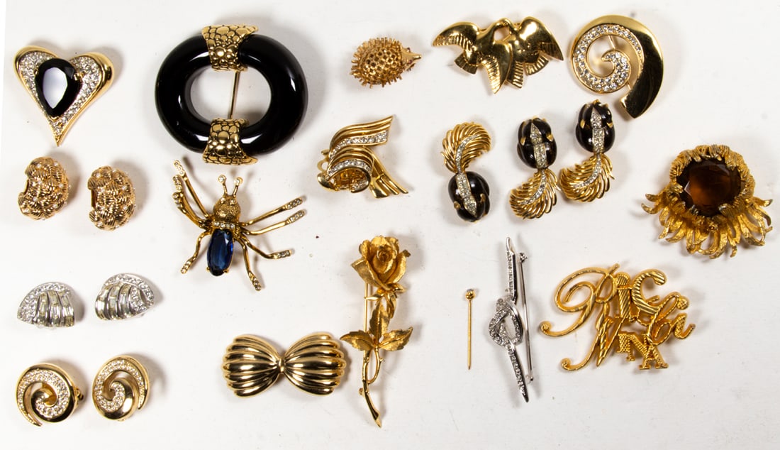 Eighteen pieces of costume jewelry comprising Nina Ricci, Givenchy, Judith Leiber, Boucher and: Eighteen pieces of costume jewelry comprising Nina Ricci, Givenchy, Judith Leiber, Boucher and DeMario, (15) brooches, (3) pairs of earrings one being Judith Leiber. [18 total}
