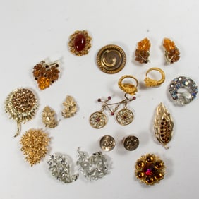 Seven Lisner costume jewelry brooches with two pairs of Lisner earrings and others