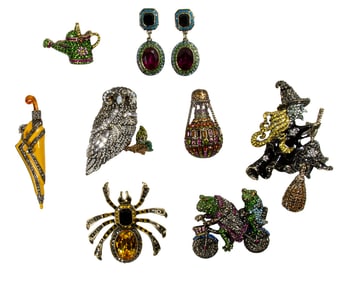 Seven Heidi Daus costume jewelry brooches, seasonal, whimsical and animals, with a pair of Heidi